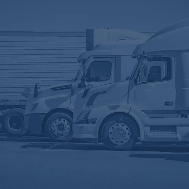Semi trucks parked at a truck stop