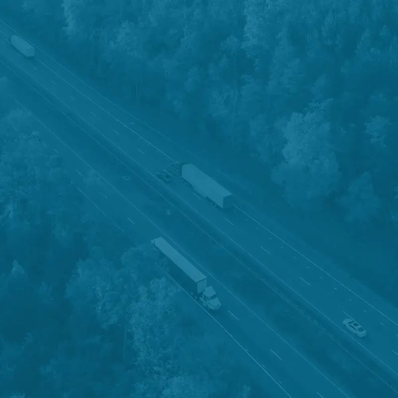 Aerial shot of a commercial truck driving on a highway